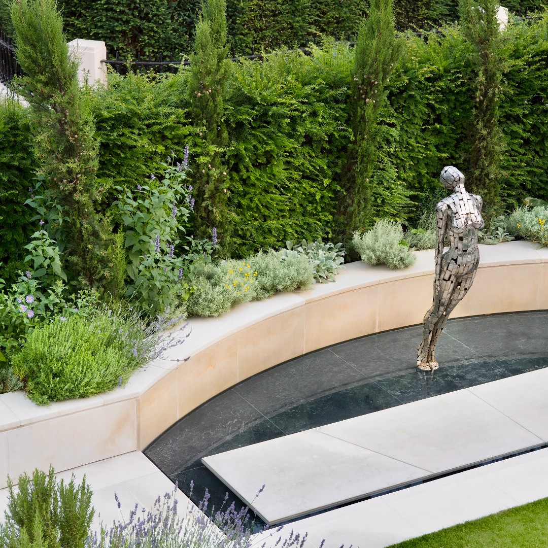 Another one of our favorite designs by Tom Hoblyn and built by us here at Bowles and Wyer. ‘The Call’ by sculptor Rick Kirby was installed into the water feature to give the impression of it floating on the water’s surface.