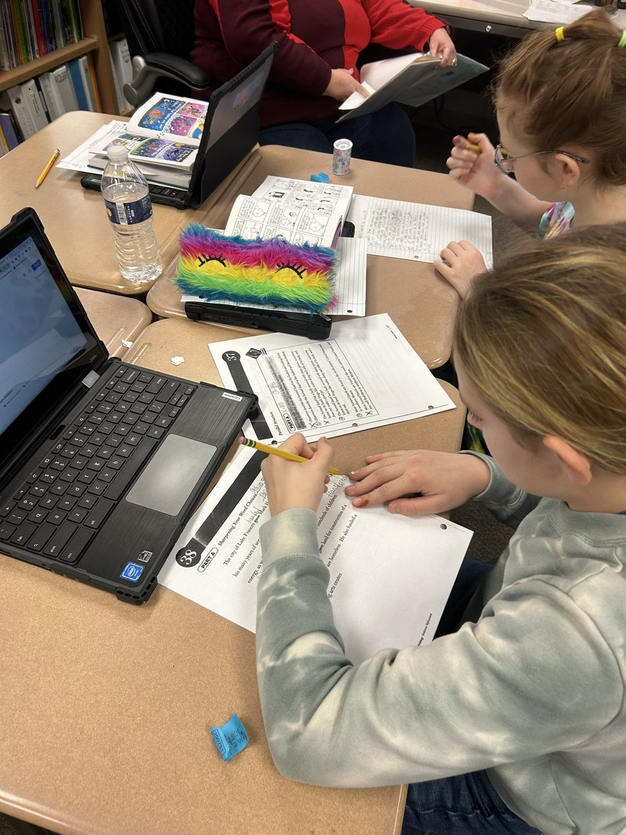 Ss working on word choice and sentence revision.