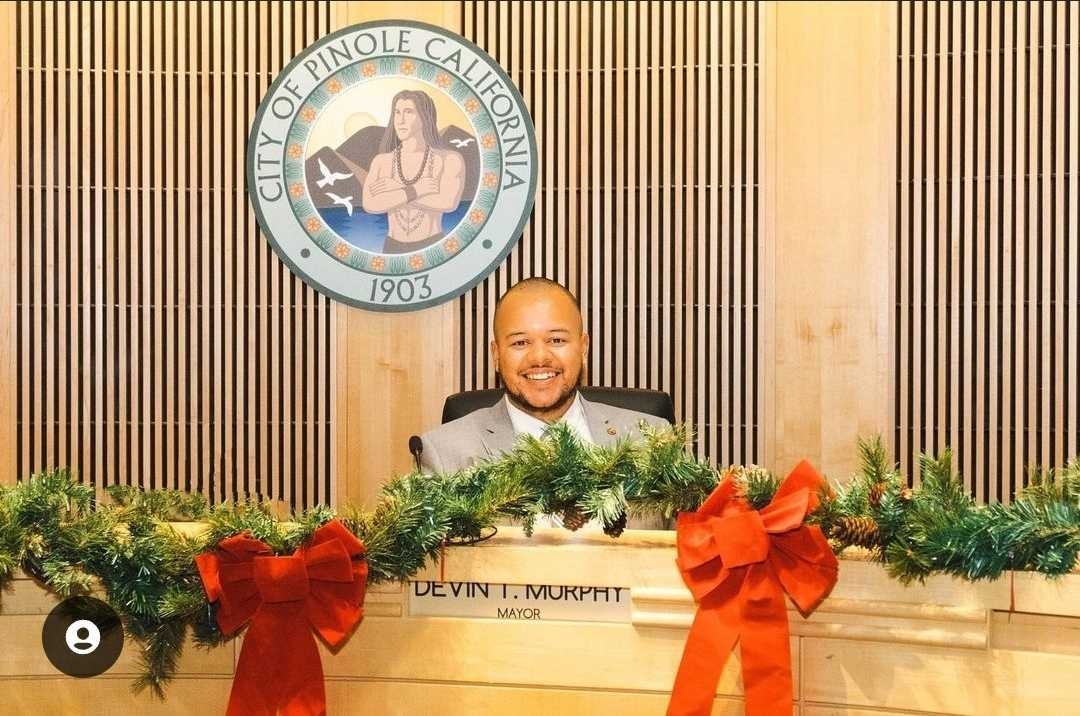 NLC's tweet photo. Congrats to Devin Murphy (NLC San Francisco ‘17) on his inauguration as Mayor of Pinole, California. He is the first Black, first openly gay, and youngest person to serve in this role. https://t.co/NlkvlcMKDy
