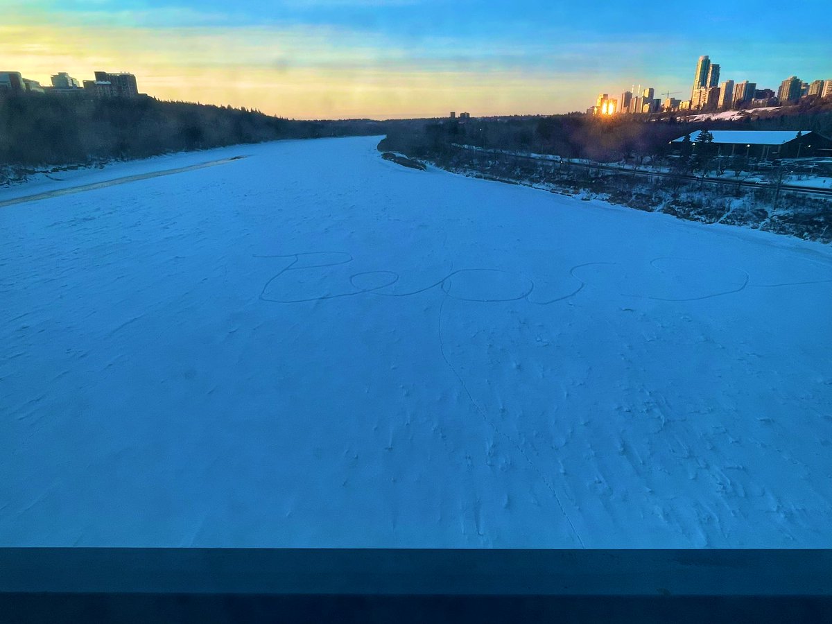 SingleYegChick's tweet photo. If you zoom in on the ice. It looks like some one (I think) walked out there and wrote the word Peace. Noticed it a few weeks back. Finally stopped in the bridge to talk a picture. #IceWalk #YegRiver https://t.co/f0CvTSmadY