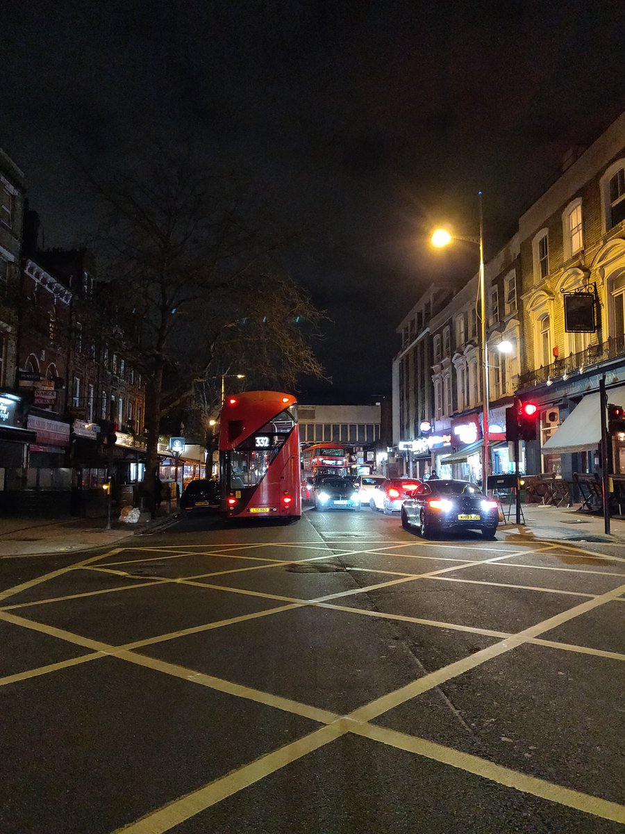 LifeInKilburn's tweet photo. 11.40pm, Kilburn High Road by junction with Cavendish Road. Cars parked on both sides of the road on double yellow lines, buses sounding their horns as cannot pass each other. Parking enforcement needed @Brent_council @CamdenCouncil. https://t.co/R6YnSRnrax