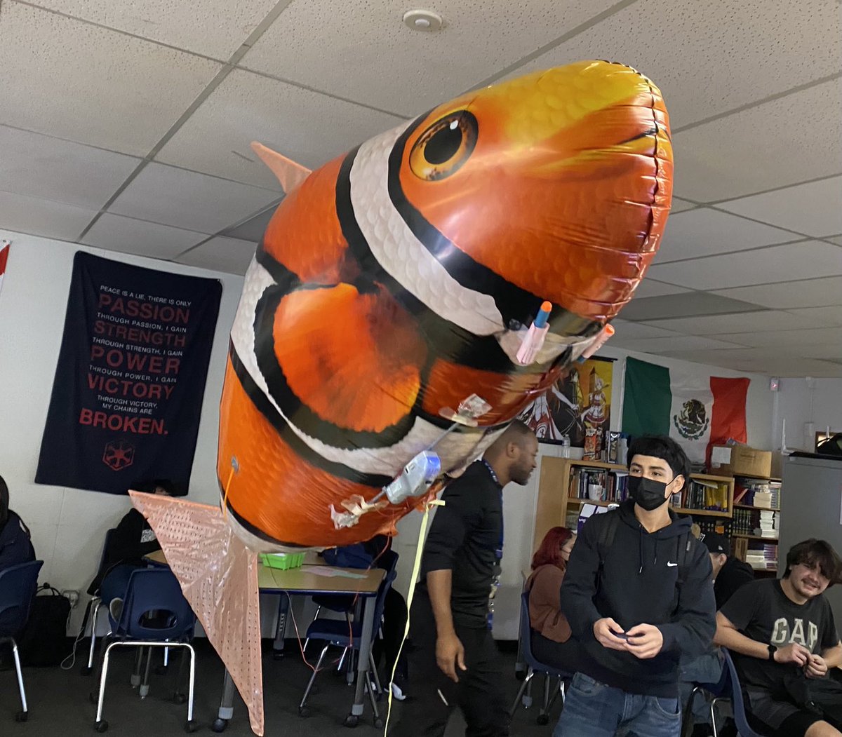 Its a Fish Zeppelin! Students are remote controlling it to drop things off.