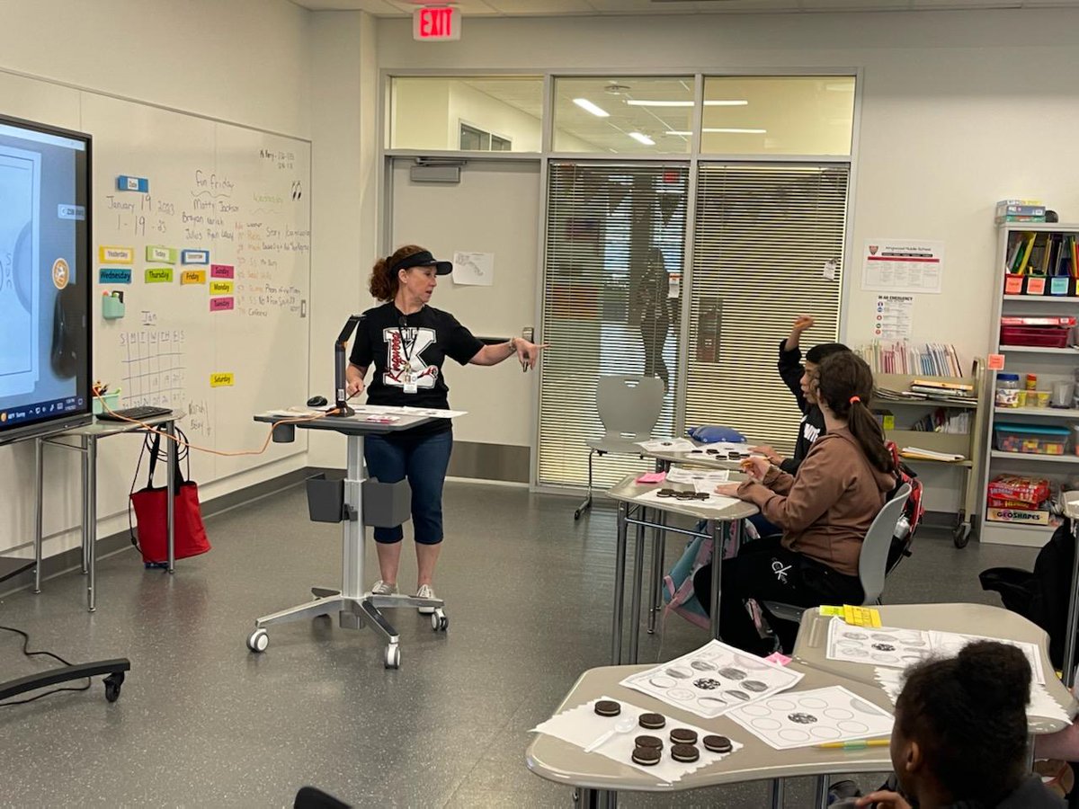 Ms Haensgen teaching moon phases using oreos. Students love it!!! #KMSCougarPride