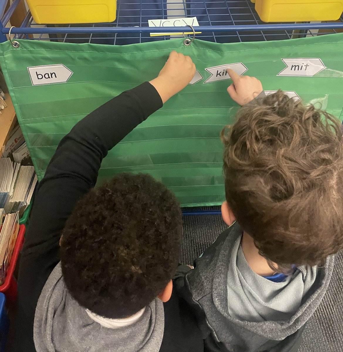 Ss building and writing 2 syllable words while I progress monitor. I love hearing the giggles of the nonsense words they read in the quest to make real words. #structuredliteracy #progressmonitoring #workstations