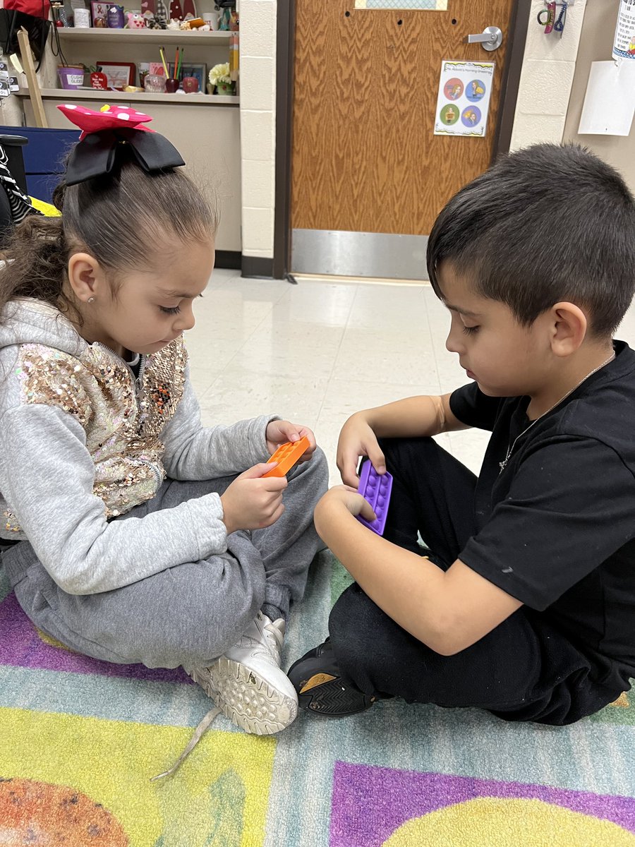 D123Sward's tweet photo. 1st graders use 10 frame pop-its with  their partner to solve addition/subtraction equations within 🔟 and even guessed the mystery number using clues! #swd123 #d123 #mathisfun #solvingequations @AmyL_Abbott https://t.co/2Cuh4WoHd6