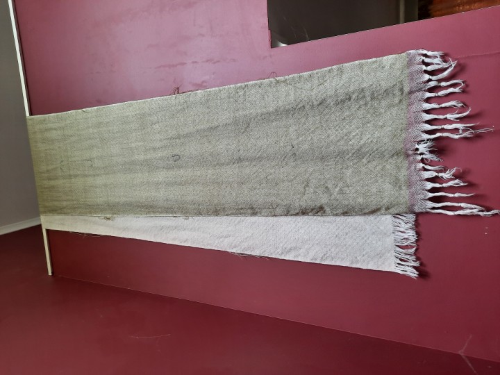 StringHerder's tweet photo. I have made a Cloth! I am unsure what it is destined to be (original plan was it to all be green, but I ran out of mystery yarn), but I am happy with it. 5.5m, approximately 55cm wide, pure wool. https://t.co/7hpSP84Uaz