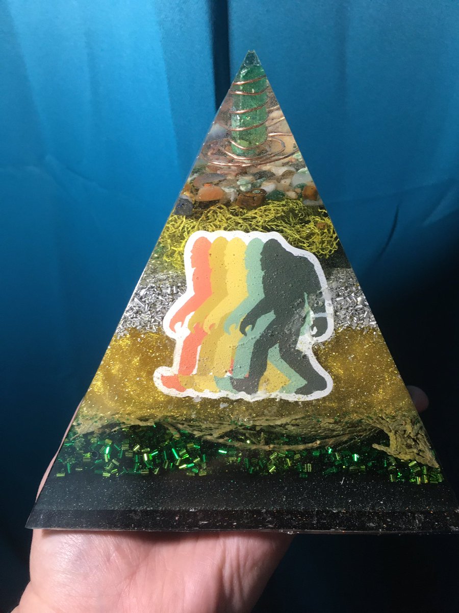 SasquatchSister's tweet photo. Sacred Sasquatch Orgonite pyramid is 5 1/2” tall and made with a variety of metals and crystals and powdered shungite &amp; moldavite. It also contains usnea and cedar and Sasquatch hair gifted to me. Made by me, Kelly Rainbow Butterfly Orgonite and Intentional Heartwork https://t.co/hKAxcu6NiD