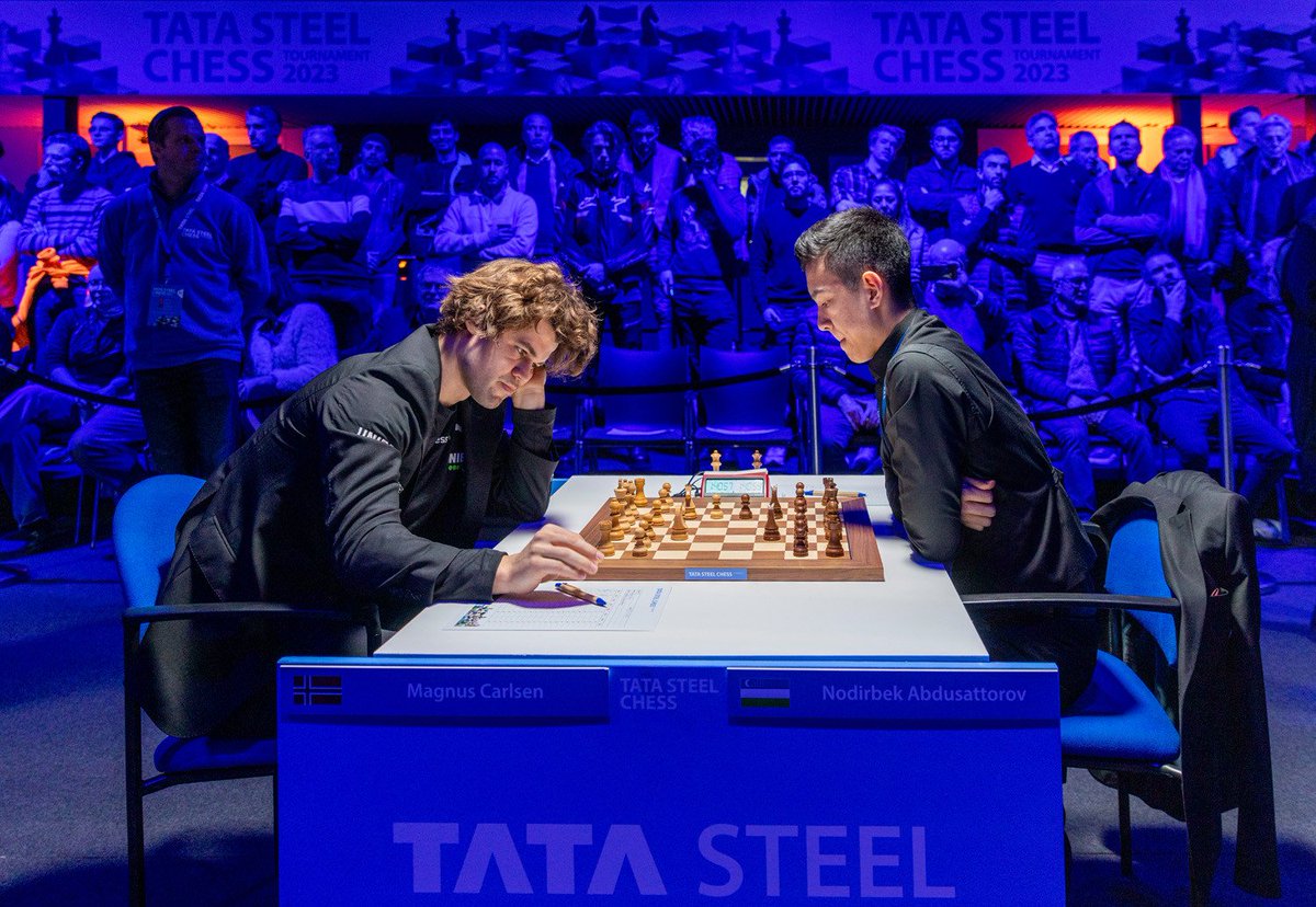 ProChessT's tweet image. 18-year-old GM Nodirbek Abdusattorov &quot;scored a goal&quot; against Magnus Carlsen in R5 of the #TataSteelMasters 2023 👏 

Fun fact: Nodirbek was born in 2004 when Magnus made his Tata Steel Masters debut!

📷 Jurriaan Hoefsmit – @tatasteelchess Tournament 2023