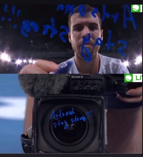 initiaty's tweet photo. #ArtsakhStayStrong wrote on the lens of a TV camera by @karenkhachanov after winning match vs ATP: 17. @FTiafoe . Next is @AustralianOpen 4th round. https://t.co/hwNtd5cJ30