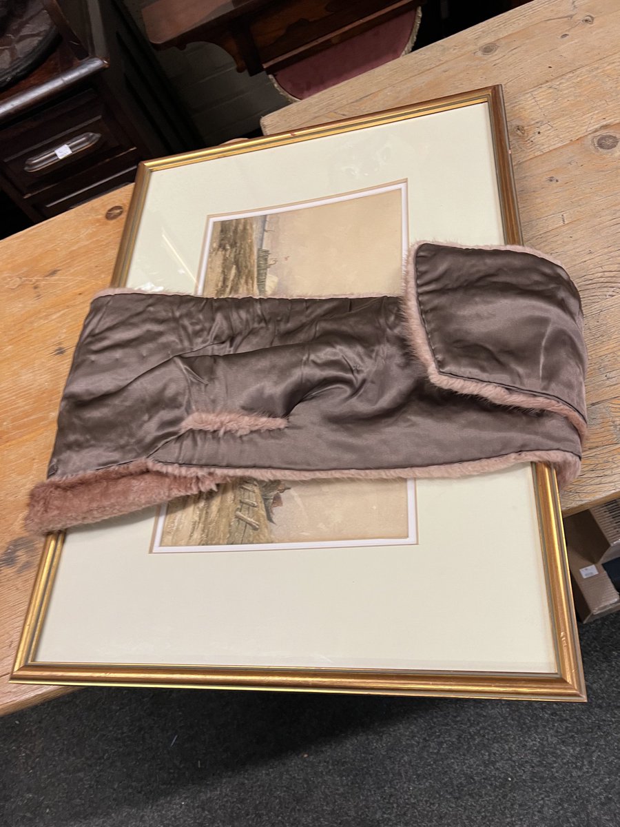 MelissaLeePat's tweet photo. When you ask your colleagues at @HHRAuctions to wrap up a framed print, only to find they’ve taken it somewhat literally… #auctionhouselife #auctionfinds #stole *ALT TEXT: a framed picture wrapped in an antique fur stole* https://t.co/DtJinld5Ou