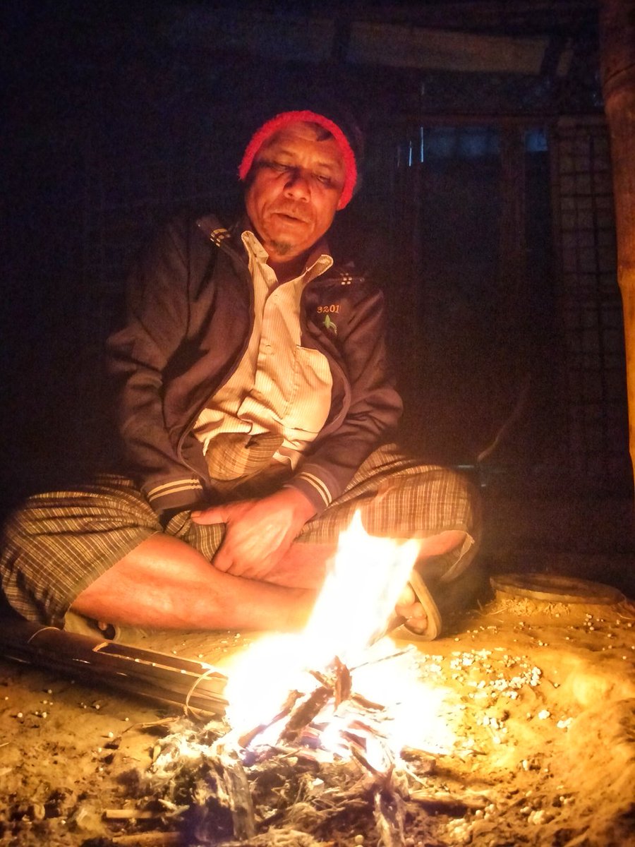 RoMonSurAli3's tweet photo. A Rohingya man is sitting by the hearth to get warm in the winter night in Rohingya Refugee Camp in Cox's Bazar, Bangladesh. 

#rohingyarefugee 
#rohingyaman 
#winter 
#fire 
#hearth 
#sitting 
#coldness 
#coldseason 
#romonsuraliphotography https://t.co/jIBxso9LIu