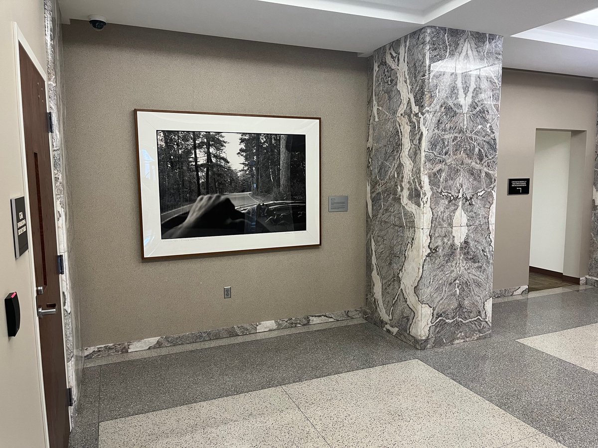 chris_steller's tweet photo. Minnesota’s Dept. of Transportation headquarters building has a very large framed photograph of a car’s dashboard with little dinosaur toys on it. #statefacts https://t.co/efvQabsqiA