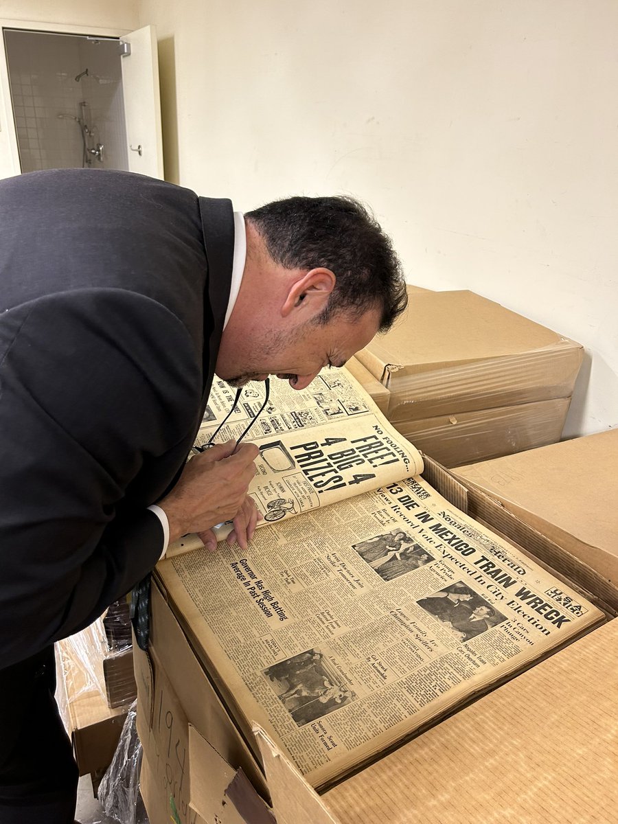 AZSecretary's tweet photo. Visiting the SOS staff at the Polly Rosenbaum Building, home to the state Library, Archives &amp; Public Records (LAPR). Pictured are 100 yrs worth of back issues of the Nogales newspaper, donated to LAPR by the @pahsmuseum Pimeria Alta Historical Society to add to LAPR collection. https://t.co/pgtOMRLDlA