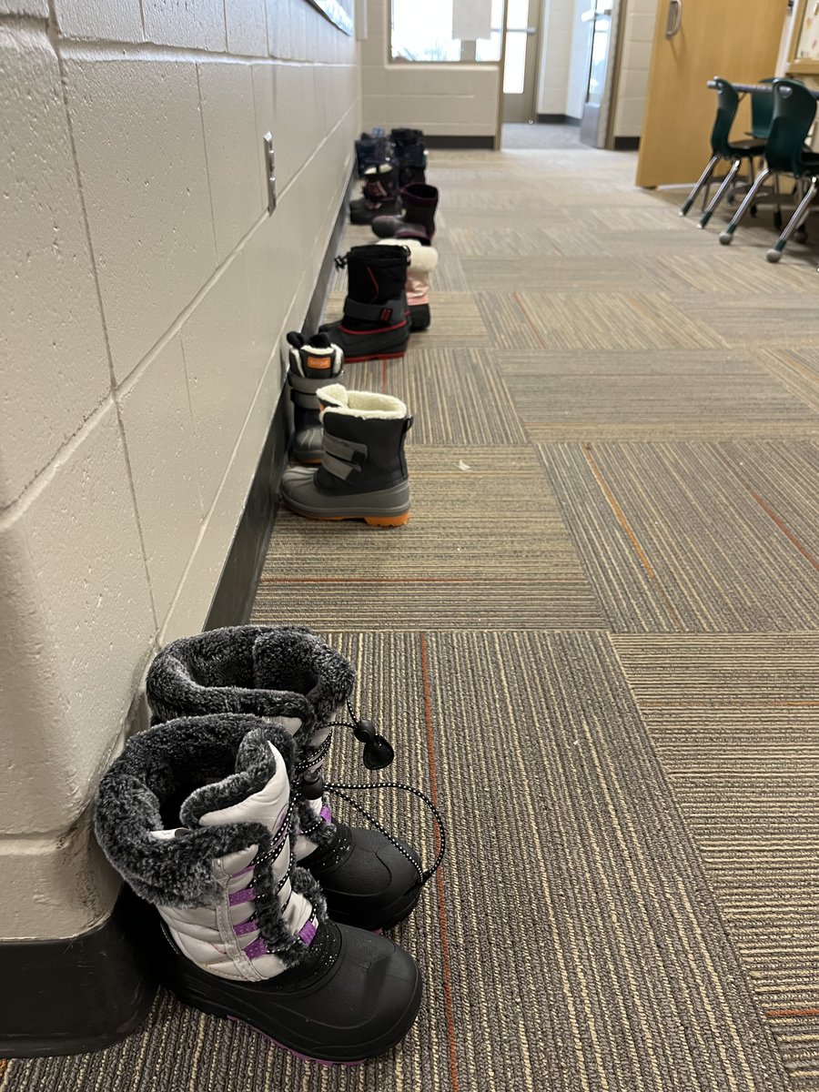 ElkhornPS_FR's tweet photo. Elementary school during the winter months equals coats, hats, gloves, scarves, and a line of boots drying in the Kindergarten hallway! The snow is here it is time to play! #EPSAchieves #FireRidgeFalcons https://t.co/zZEFGIqjt2
