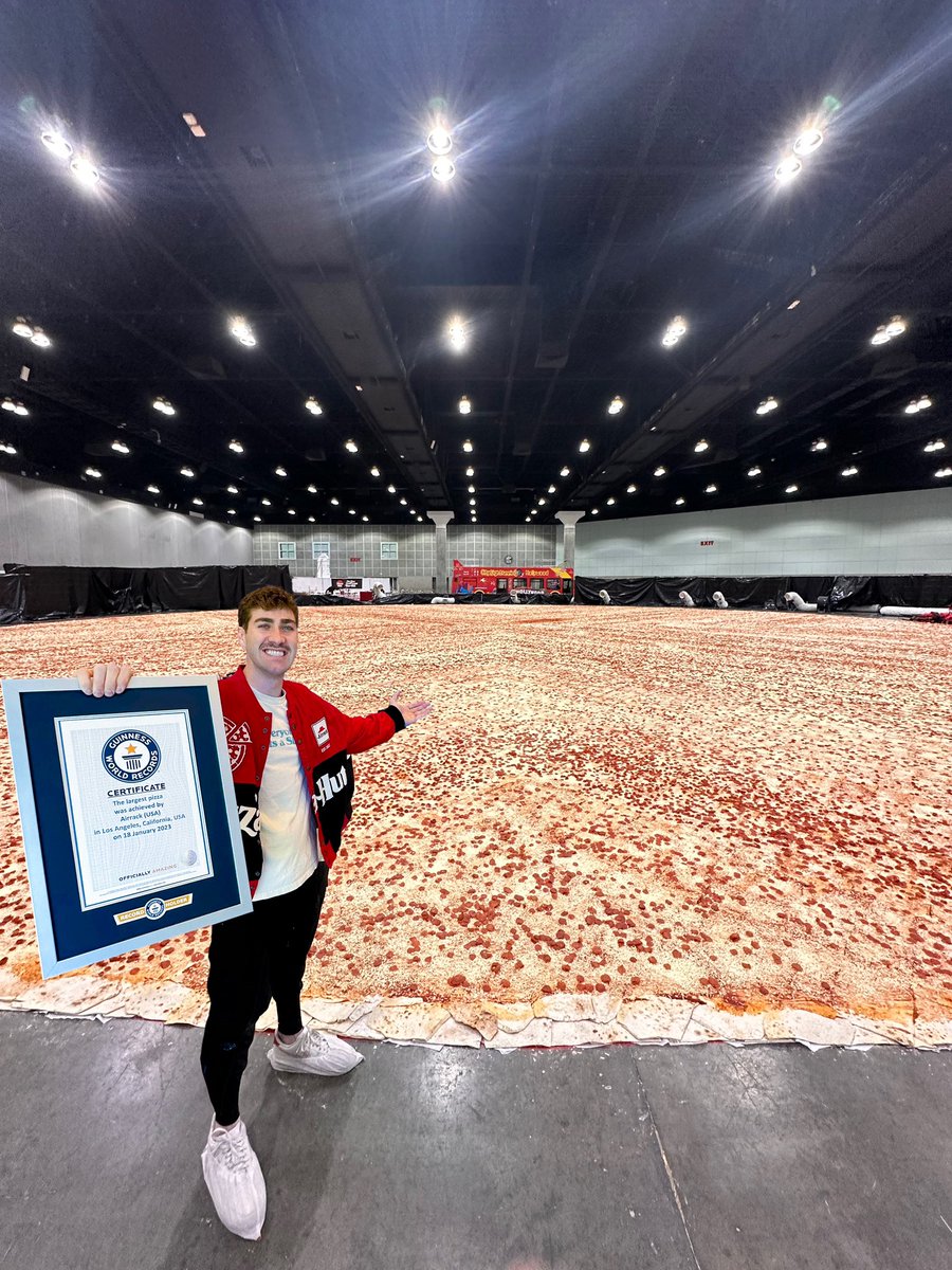 True story: When I was 8 yrs old I threw a pizza party at a bowling alley and no one showed up. To get revenge, I spent the past 18 years scheming how to make the worlds largest pizza and today it happened. No one out-pizzas the hut. <a href="/pizzahut/">Pizza Hut</a>