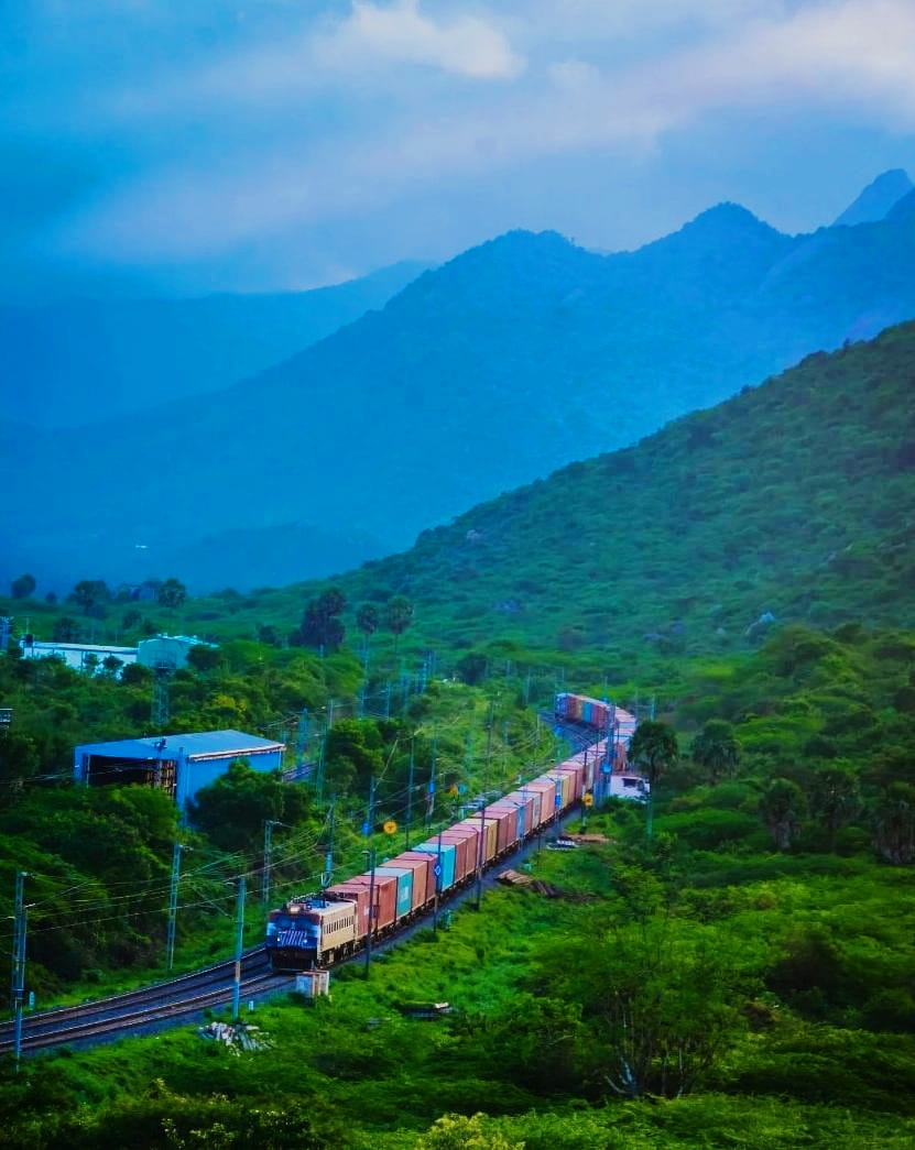 A goods train laden with containers meanders through the greenery with the beautiful Western Ghats in the background - Near Madukkarai

#SouthernRailway #MoveItLikeRailways