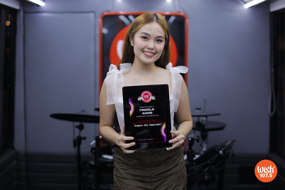 LOOK: OPM act <a href="/FrizzleAnne_/">Frizzle Anne Music</a> received her Wishclusive Ballad Performance of the Year nomination plaque for "Alam Ko Naman"!