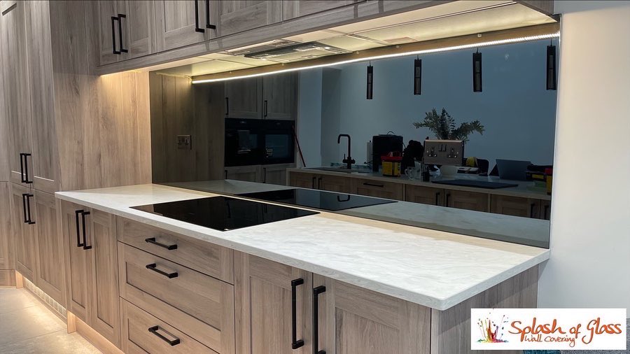 officialASOG's tweet image. Add a splash of glass in your home this new year!Our glass slashbacks are easy to maintain and bounces light back into the room all while maintaining it’s beauty!

This image shows a toughened grey mirror that our team had fitted in Swansea. Finishing the kitchen off with style!
