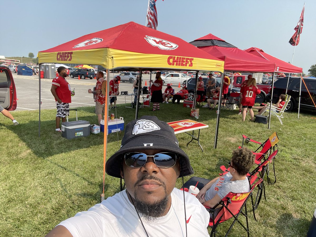 SUPERILES's tweet photo. #GEHASweepstakes 1st photo is me prepping for a game while I was in the Navy in Sigonella, Sicily. 2nd is my “Bear Cave” Chiefs shrine for away games. 3rd is tailgating with the Tailg8trs near gate 3. 4th is our dog Zino getting ready for a game in the bear cave. @GEHAField https://t.co/KhaIIN0jnH