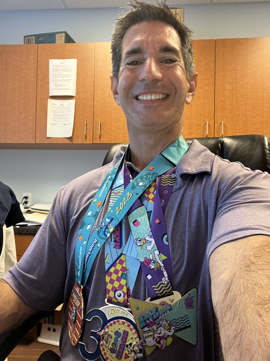This is acceptable work attire the day after the marathon, right?  #medalmonday #DisneyWorld #runDisney #disneymarathon