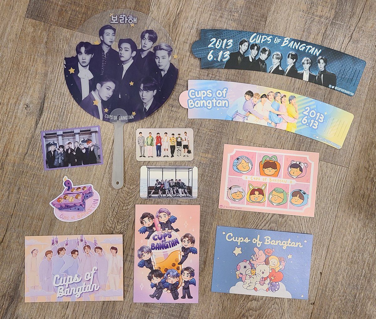 HELLO EVERYONE!
The plan is to have another OT7 event this summer, &amp; to help raise funds for it we're doing a special OT7 cupsleeve bundle + OT7 fan for only $7! Everything you see in the picture is what you will receive. You can purchase them for pickup from <a href="/chiminiemagcshp/">𝐶ℎ𝑖𝑚𝑖𝑛𝑖𝑒’𝑠 𝑀𝑎𝑔𝑖𝑐 𝑆ℎ𝑜𝑝</a> -