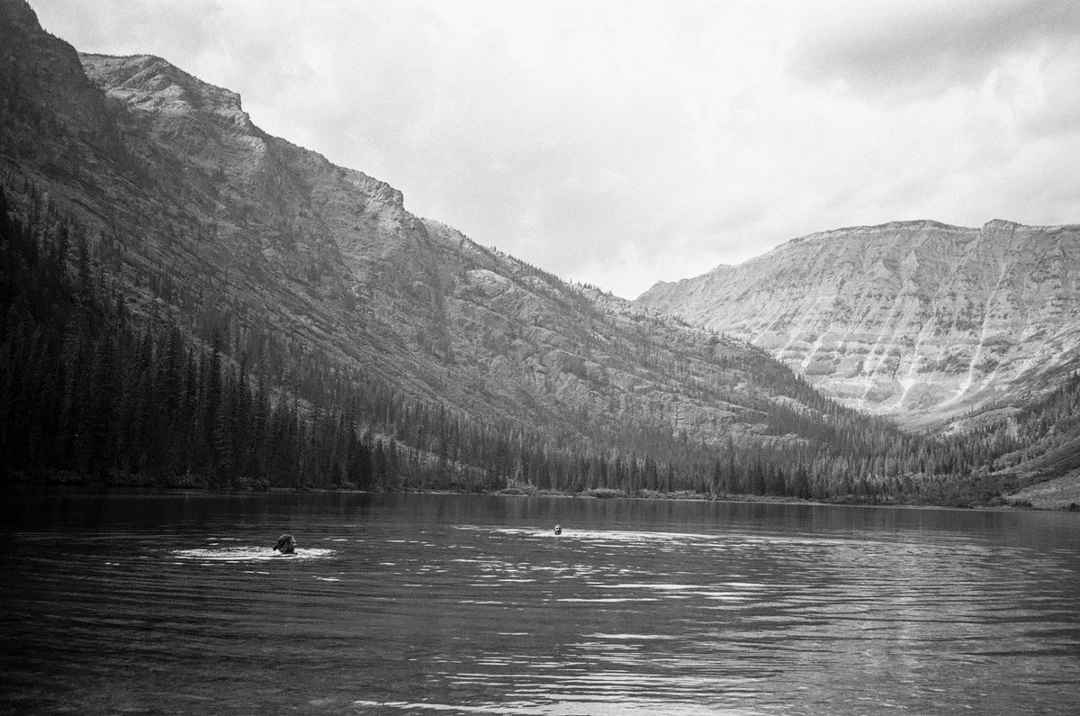 pauljpastor's tweet photo. Glacial lake swim in Montana (I on left), 35mm film shot by the estimable ⁦@Josh_Clouser⁩. https://t.co/3gXl50v6Si