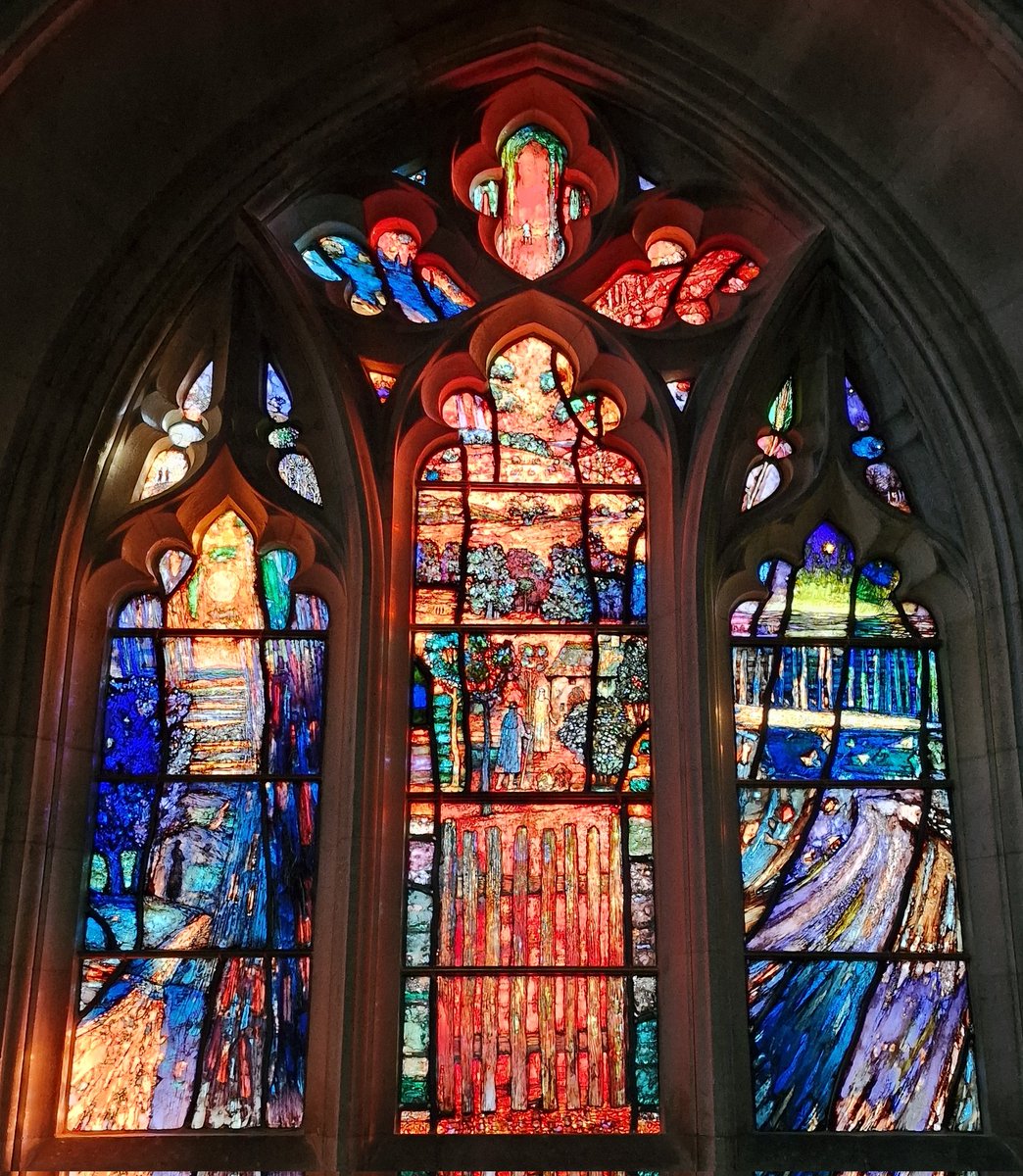 StroudStory's tweet image. The bang new #stainedglass by Tom Denny at Down Ampney, #Gloucestershire, just installed in Dec, is, even in low light levels of a winter's afternoon, a thing of glowing wonder. Based on the Pilgrim's Progress, celebrating the 150th anniversary of the birth of Vaughan Williams.