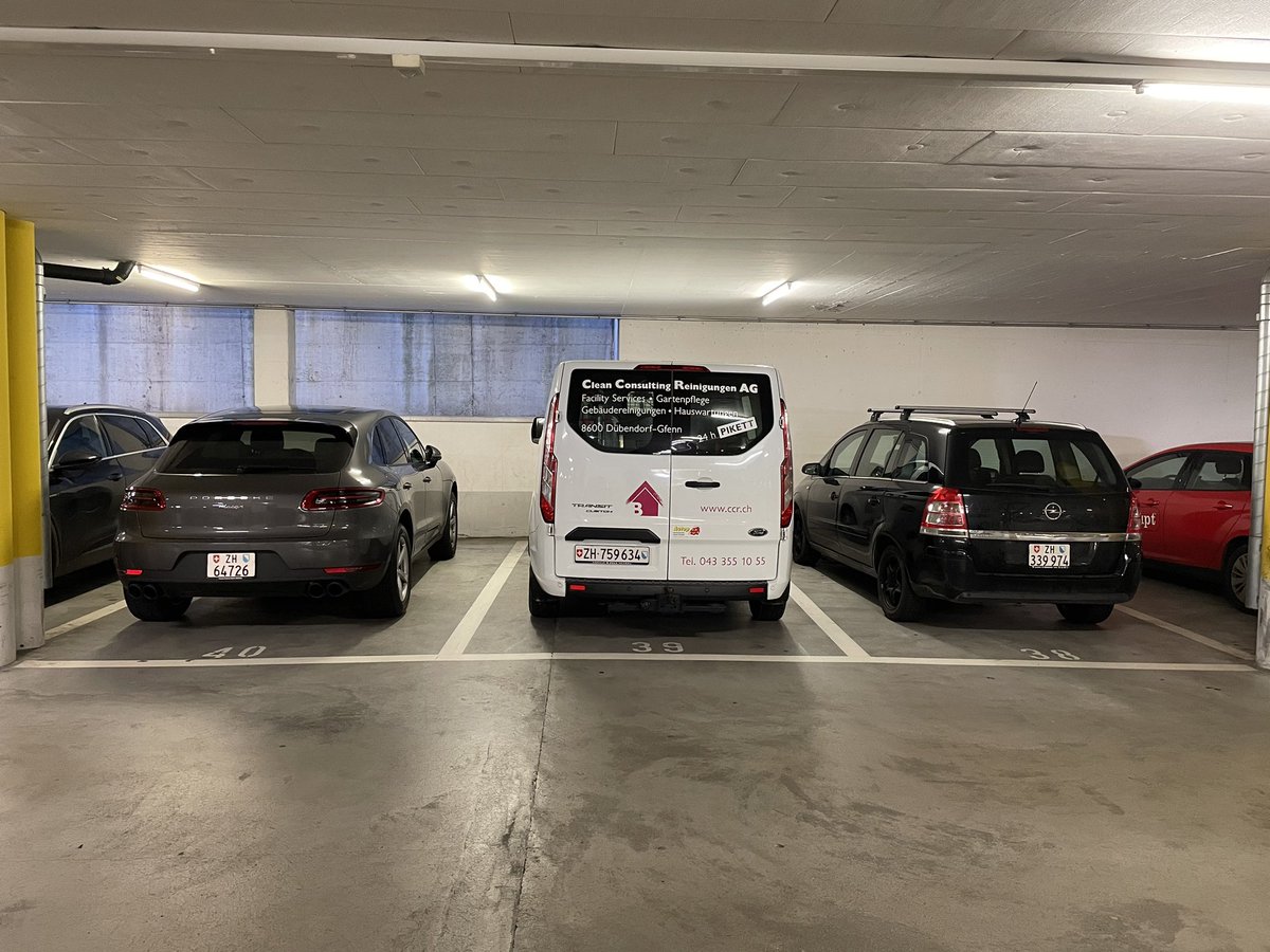 Two car parking designs:

Japan: "Let's draw some space between cars, so people can get out."

Switzerland: "Your space goes from the edge of the left line to the edge of the right line. You can get back in through the trunk if both your neighbors park too closely."