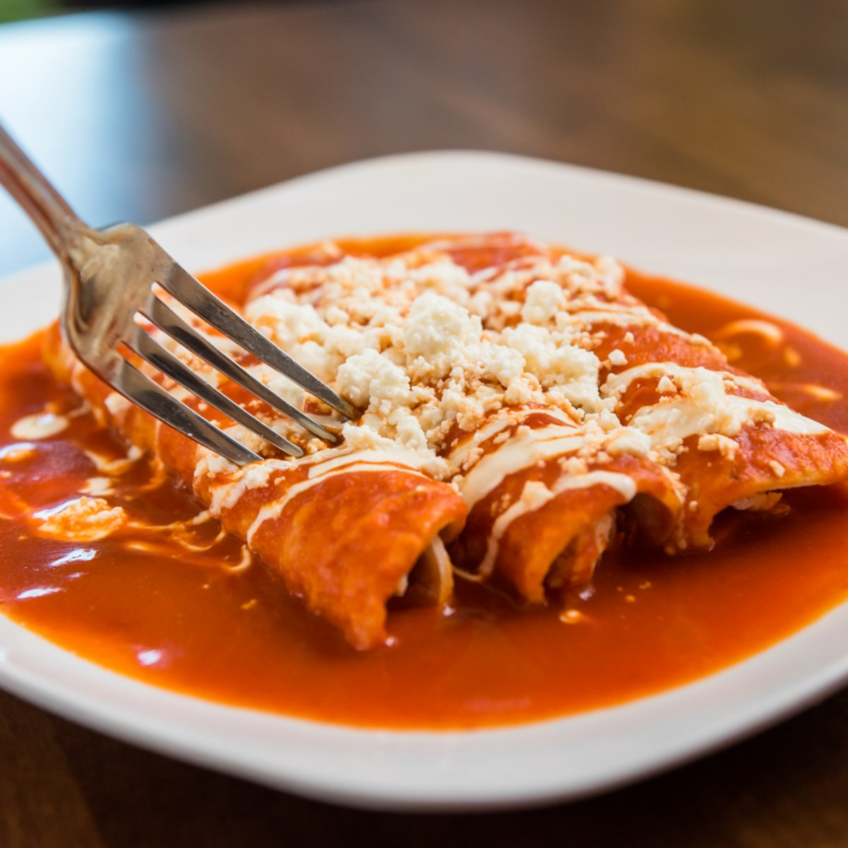 A true taste of Mexico awaits you at Luna Y Sol! Come grab a delicious forkful of our cheesy enchiladas this week. #MexicanCuisine
