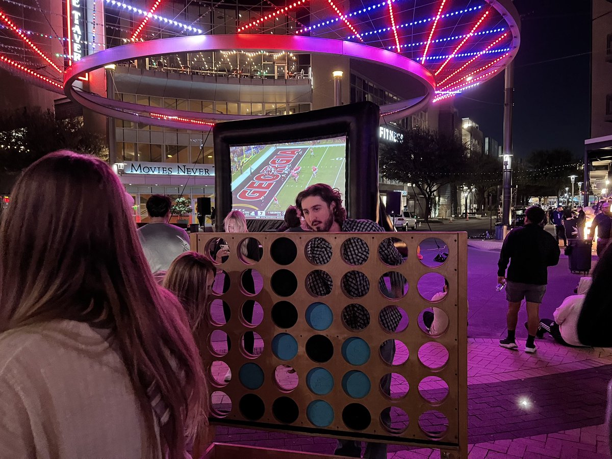 eclarridge's tweet photo. At Crockett and Currie streets in Fort Worth, this Connect Four game is drawing nearly as much interest as #TCUvsUGA https://t.co/D3ocsbU5xk