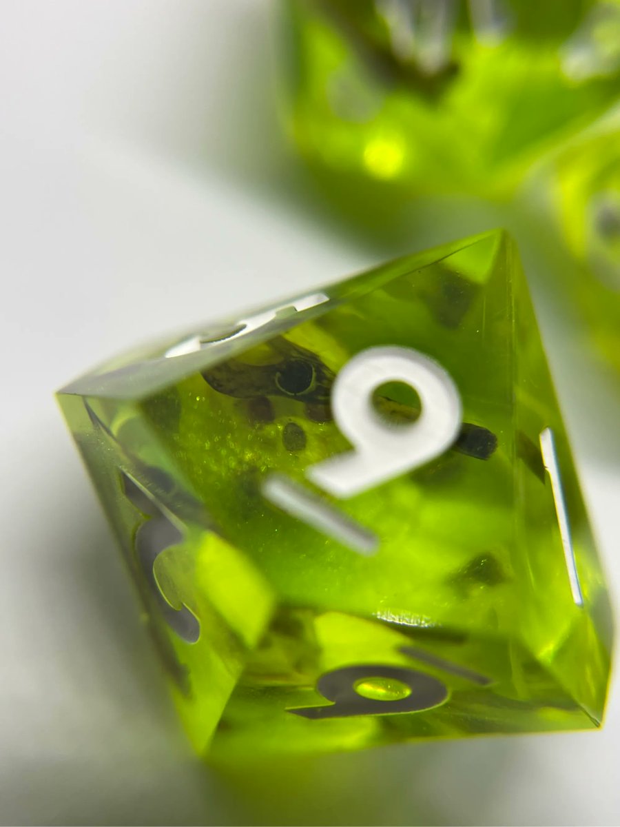 This was a fun set for a custom order! Gelatinous cube dice! 💀 WITH REAL BONES! I love how they turned out 😍

 #dice #dnddice #ttrpg #handmadedice #d20 #dnd