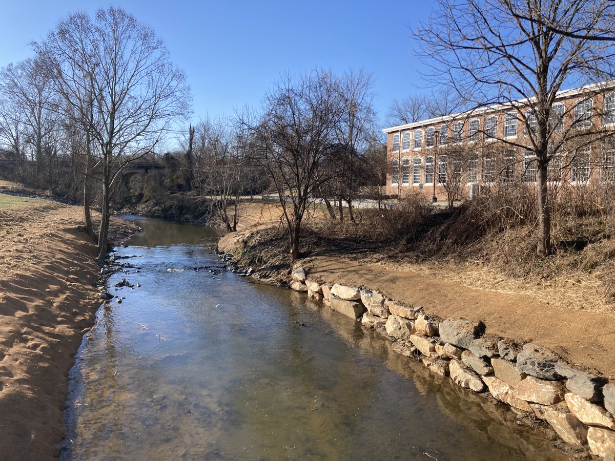 A beautiful stream restoration now graces the historic Revolution Mill project. <a href="/SelfHelpCU/">Self-Help</a>  does such motivating real estate projects!