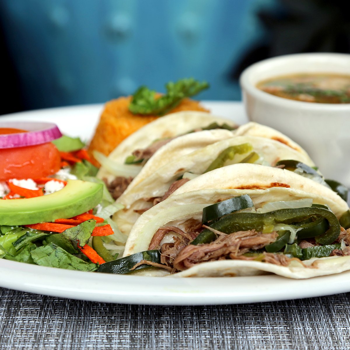 anamiastexmex's tweet photo. It's Taco Tuesday! Tacos a la Mexicana– Three flour tortillas filled with slow-roasted brisket, sautéed poblano peppers and onions. Served with avocado salad, bean soup and rice. 😍 🌮 🌮 🌮 https://t.co/tDBZ8ziTcV