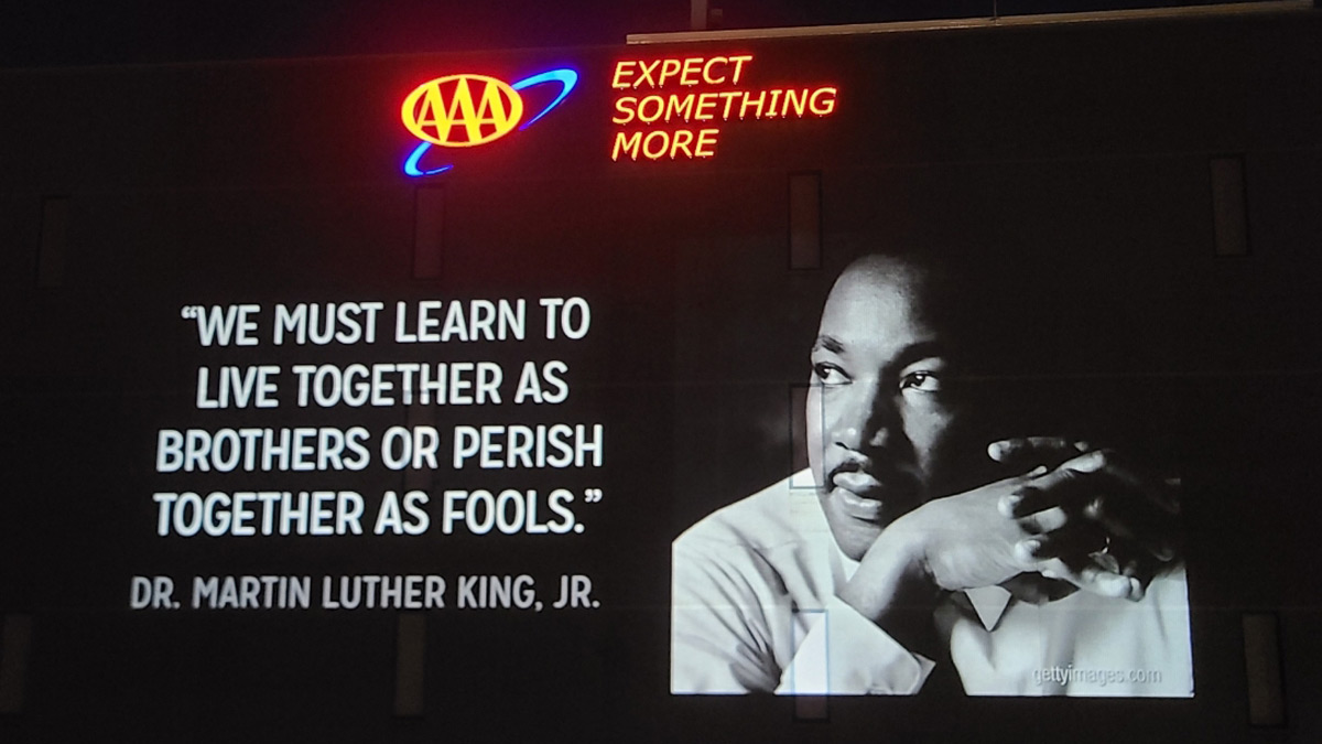 AAAWisconsin's tweet photo. As we honor the legacy of Dr. Martin Luther King, Jr., we’re projecting his words of wisdom on our Michigan headquarters and reminding ourselves that the time is always right to do what’s right for our members. #WeAreAAA https://t.co/vlJVj6C4Cj