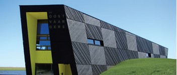 HealthyWood's tweet photo. The Oostvaarders Nature Center uses an ebony color on its cladding to mimic the dark silhouettes of grazing cattle dotting the horizon of the reserve. Read more about this impressive project’s use of Sansin: https://t.co/l74rk10Ye3. 

#Sansin #HealthyWood https://t.co/NW2xyvdrpG
