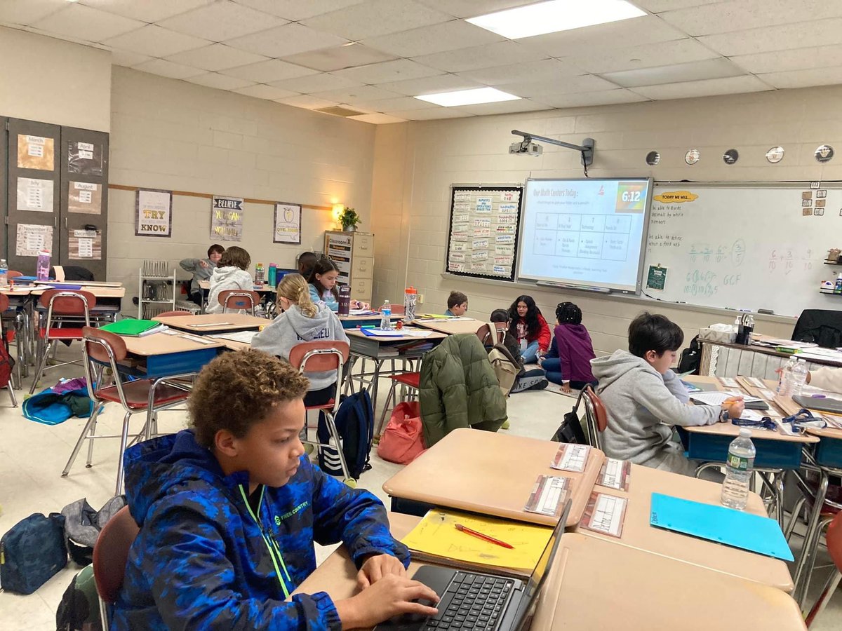 FTSD_'s tweet photo. 5th grade Math centers discussing problem solving skills. #RiverfrontRocks💙💛 @FTSD_Riverfront https://t.co/3KrSrKTNYZ