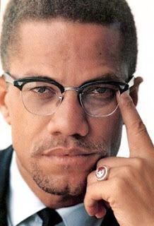 Vision4theBlind's tweet photo. Malcolm X with the Masonic pose while also wearing a Shrine Crescent Freemason Ring. https://t.co/V335Shfbz5