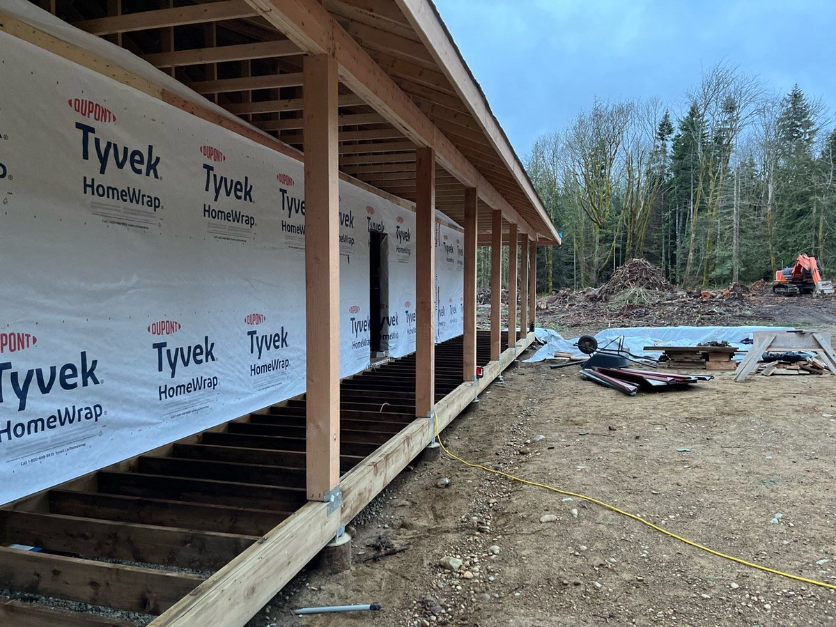 Framing in the wrap around porch on a custom home we are building up on Denman Island. View of this property from a nice patio chair will be lovely! Design by Evolvr Interior Design.

#customhomebuilder 
#projectmanagement 
#carpentry
#gulfislands 
#quality 
#framing
#remotework