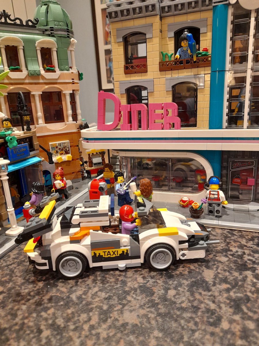 woodsm38's tweet photo. @LEGO_Group "Meet the electric S-uber Uber Brickati whizzing about downtown picking up fares in his taxi" #BuildLikeAMaster entry from Liam Woods https://t.co/Q8uA7TlJgD
