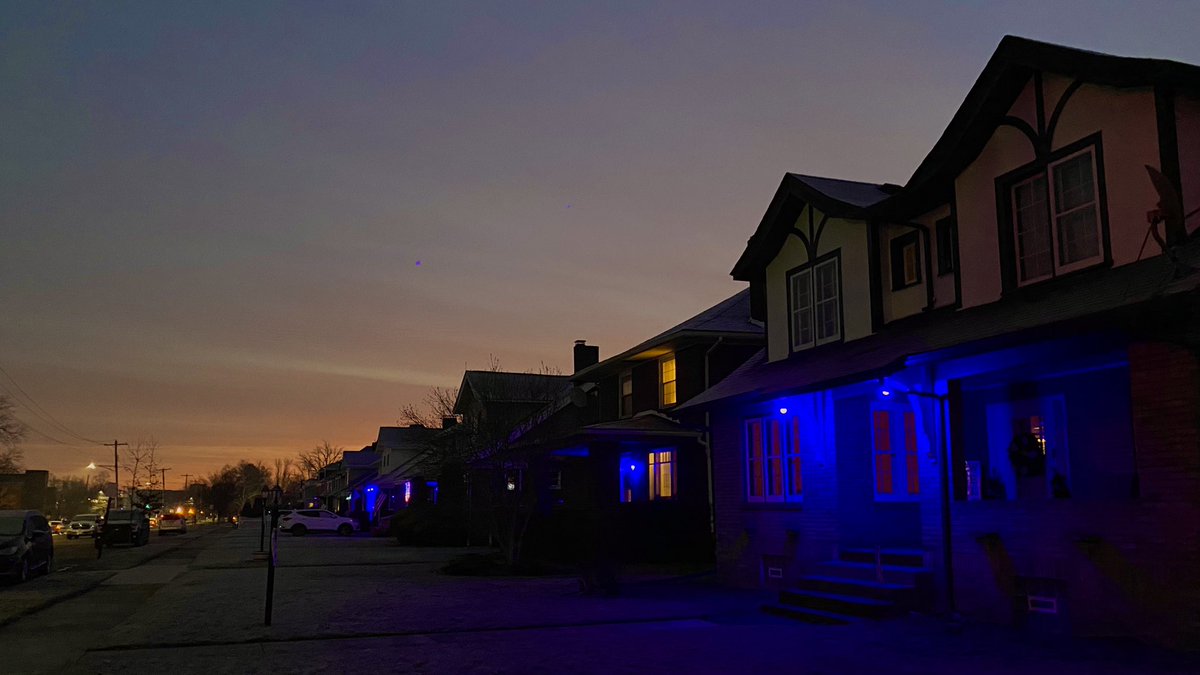 Houses lit with blue lights in Natrona Heights along Freeport Rd to honor Brackenridge Police Chief Justin McIntire. The funeral procession will pass by here later today.