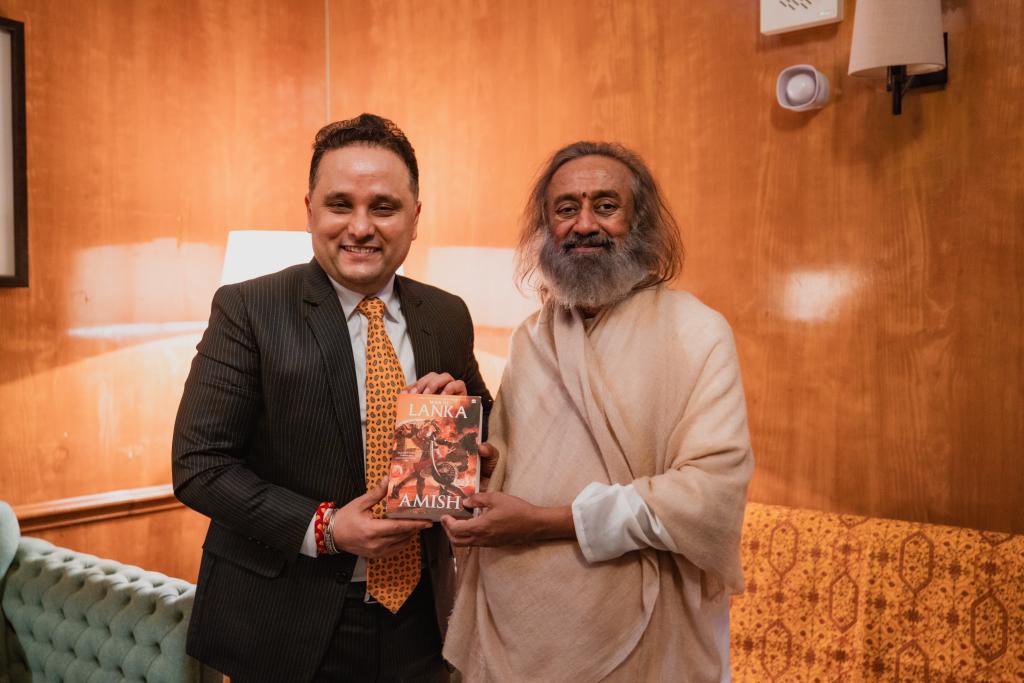 authoramish's tweet photo. Was an honour to meet Gurudev @SriSri in London last evening, along with HE @VDoraiswami ji, the High Commissioner of India to the U.K. 

Gurudev is a symbol of wisdom &amp; peace for the world. 

He has kindly supported my books earlier, and I presented a copy of #WarOfLanka to him https://t.co/94p81wR94J