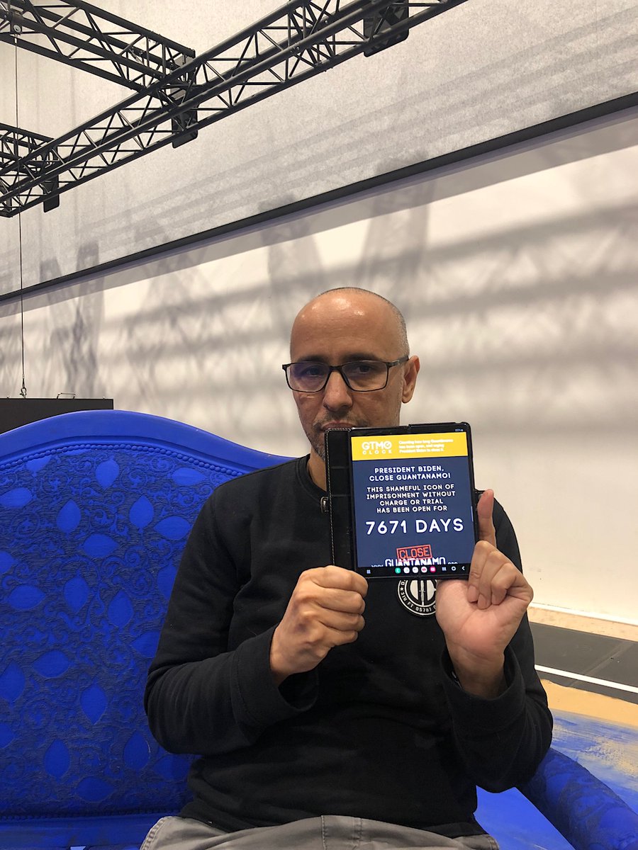 GuantanamoAndy's tweet photo. Marking 7,671 days of #Guantanamo's existence today (the 21st anniversary of its opening), former prisoners Mansoor Adayfi &amp; Mohamedou Ould Slahi urge President Biden to close it without further delay. Please join them! https://t.co/fTMVPEbM4z https://t.co/Z5yDjS8Yq9