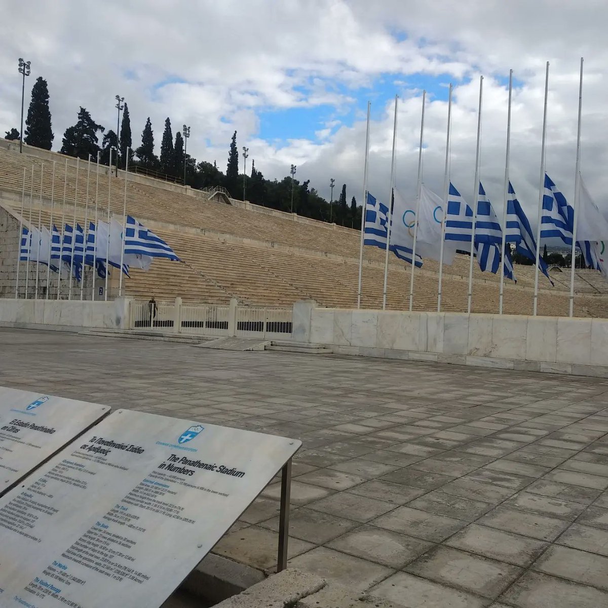 HellenicOlympic's tweet photo. Με απόφαση της Ελληνικής Ολυμπιακής Επιτροπής οι σημαίες στο Παναθηναϊκό Στάδιο  και στα γραφεία της ΕΟΕ κυματίζουν μεσίστια για την απώλεια του τέως Πρόεδρου της ΕΟΕ και χρυσού Ολυμπιονίκη , τέως Βασιλιά των Ελλήνων Κωνσταντίνου https://t.co/bzuRrc4k5A