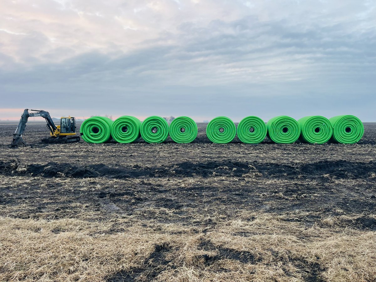Hoping to get these rolls installed before spring!  We’re firing up the mini hoe to dig some starts this morning! #tile #drainage #watermanagement