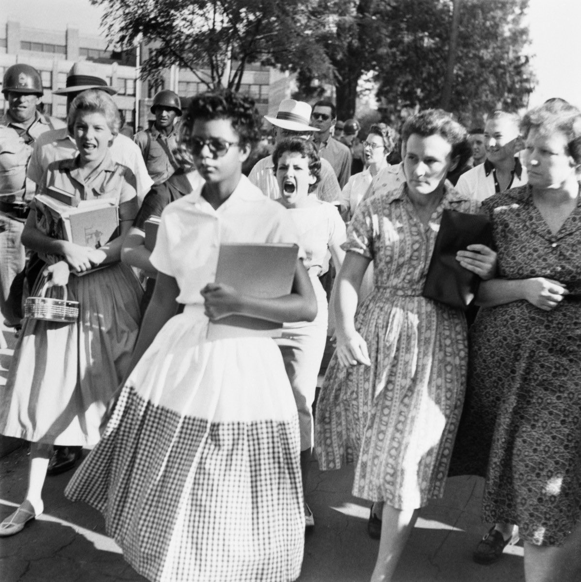 Just to reiterate, the Governor and chief executive of the state in which this photograph was taken has now signed an executive order that could jeopardize anyone who dares to share this photograph in the very school being desegregated in this photograph.