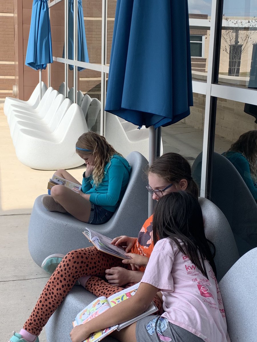 Enjoying the nice weather with a great book out on the  library patio!  A GREAT way to end the day.  <a href="/humbleisd_CE/">Centennial Elementary</a>