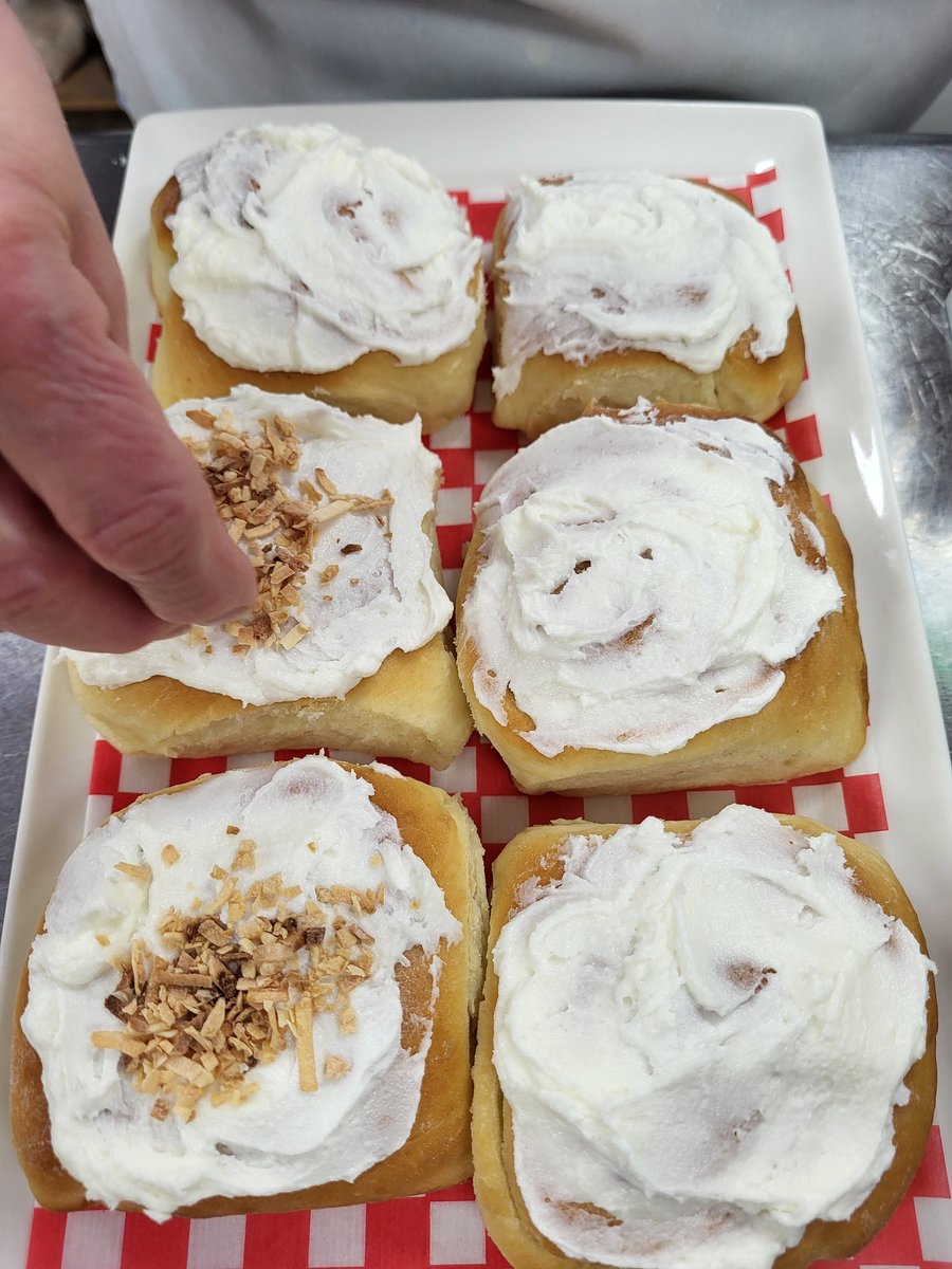 Putting the finishing touches on the Butter Horns. We slice 'em in half and grill with butter. #freshbaking #medhat