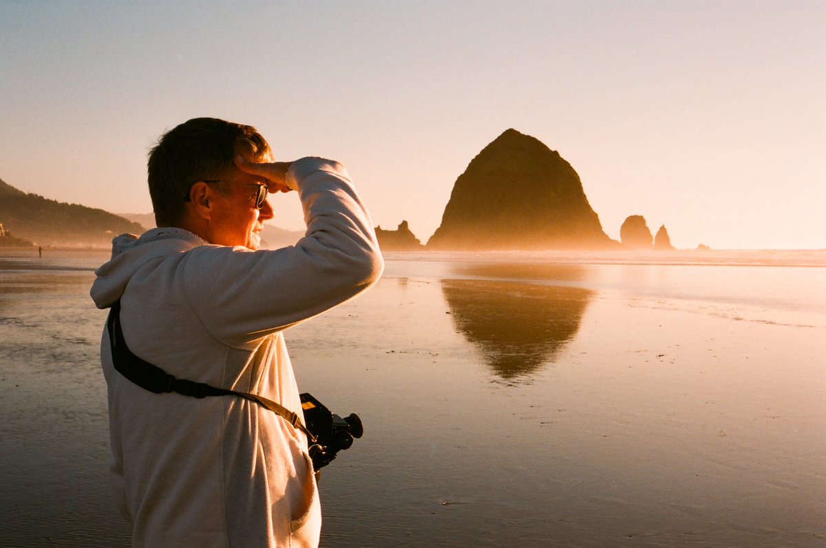 braehunz's tweet photo. My dad shooting film for the first time in 20 years. Took him to one of his favorite places, Cannon Beach, where he put a few rolls of Portra through my first film camera, the Bronica SQ (which he gifted me). A special day that I will cherish forever. https://t.co/7LnqXBc9Jr