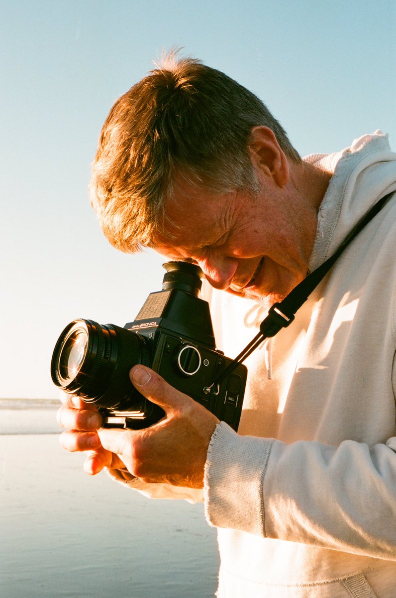 braehunz's tweet photo. My dad shooting film for the first time in 20 years. Took him to one of his favorite places, Cannon Beach, where he put a few rolls of Portra through my first film camera, the Bronica SQ (which he gifted me). A special day that I will cherish forever. https://t.co/7LnqXBc9Jr