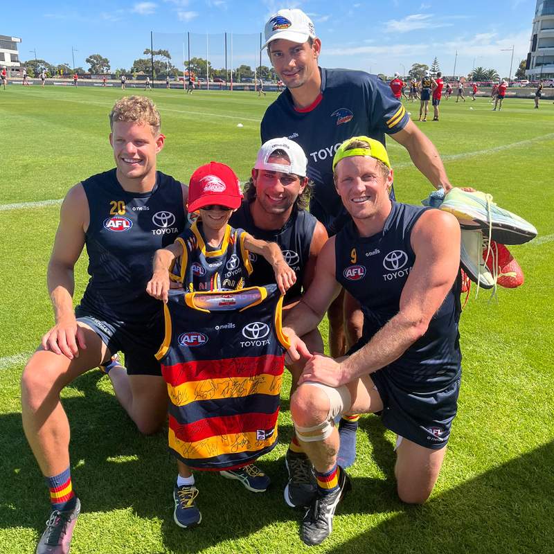 Adelaide_FC's tweet photo. We had a very special guest at training this week. Thanks for visiting, Enzo 😊 

#weflyasone @CrowsFoundation